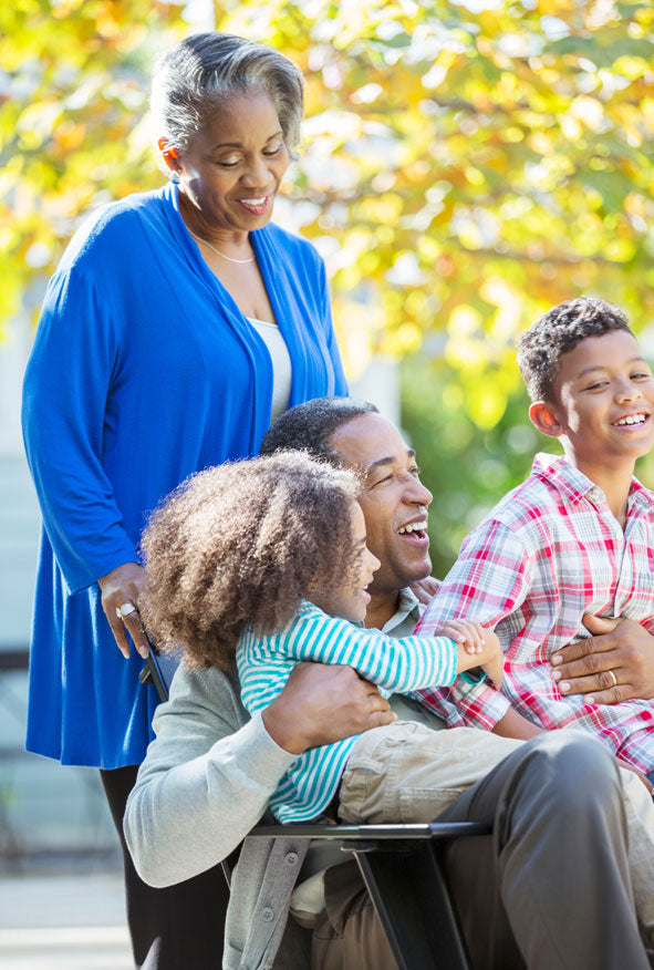Grandparents spending time with their grandchild, representing a home grandparent DNA test