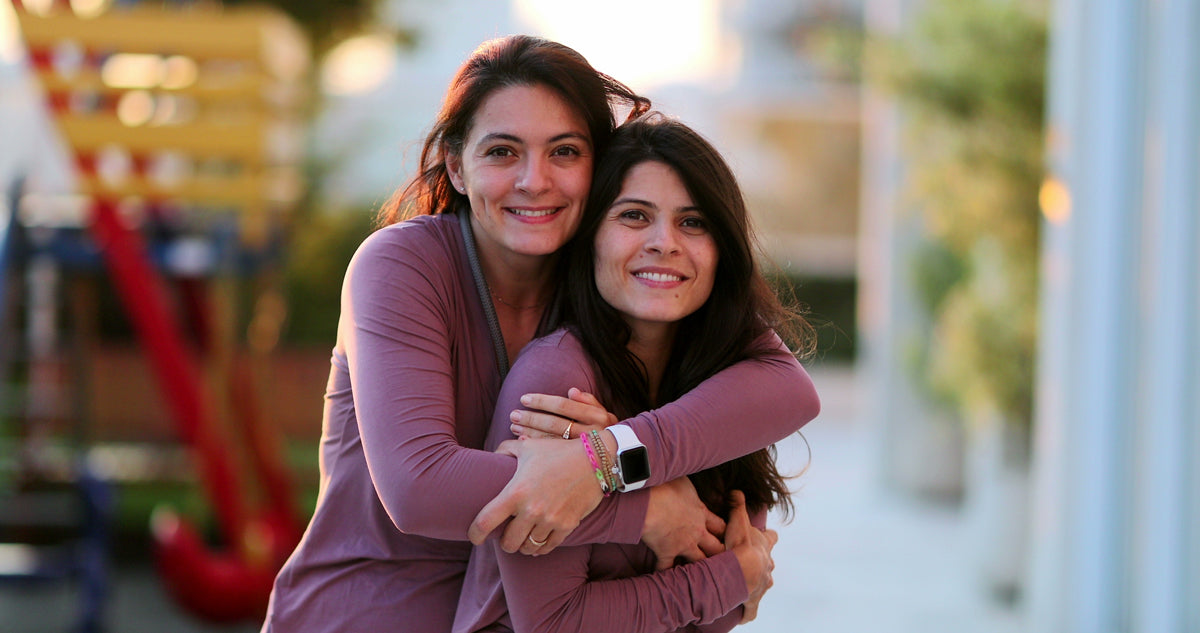 Adult sisters representing sibling DNA testing for biological relationship confirmation