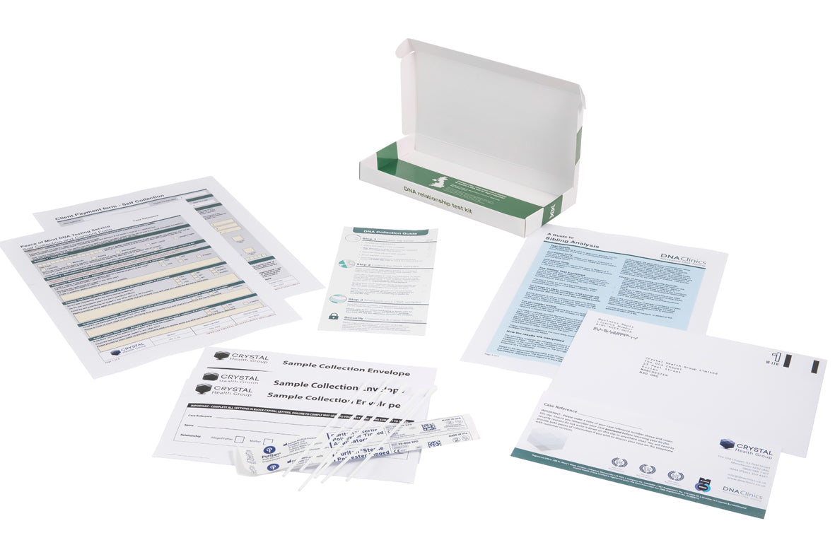 Home grandparent DNA test kit components laid out, including swabs, envelopes and paperwork.